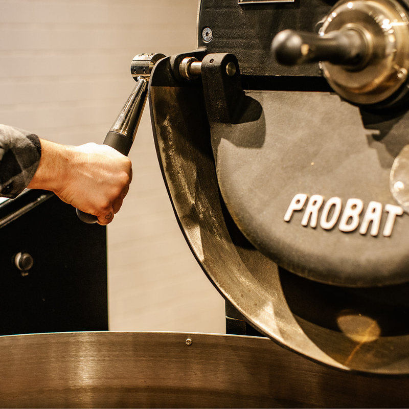 Hand pulling lever on coffee roaster